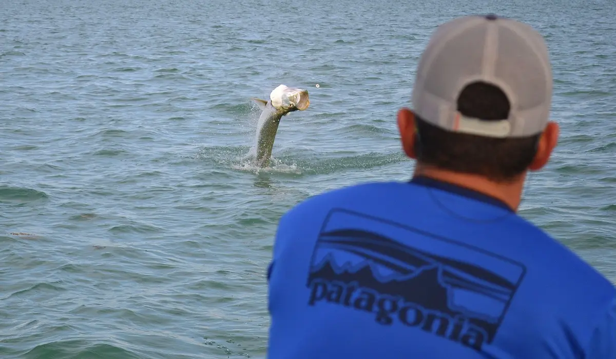 Angler holding mutton snapper caught on a 4 hour inshore fishing charter Biscayne Bay Miami